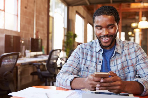 Man paying bills on his phone